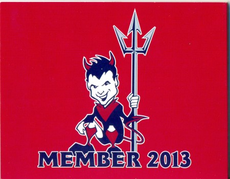 Back cover of 'Melbourne Football Club: Young Demon Member 2013 [sticker book]', colour cover stapled with blank pages, 9.5 x 12 cm. Collection of Mandy B.